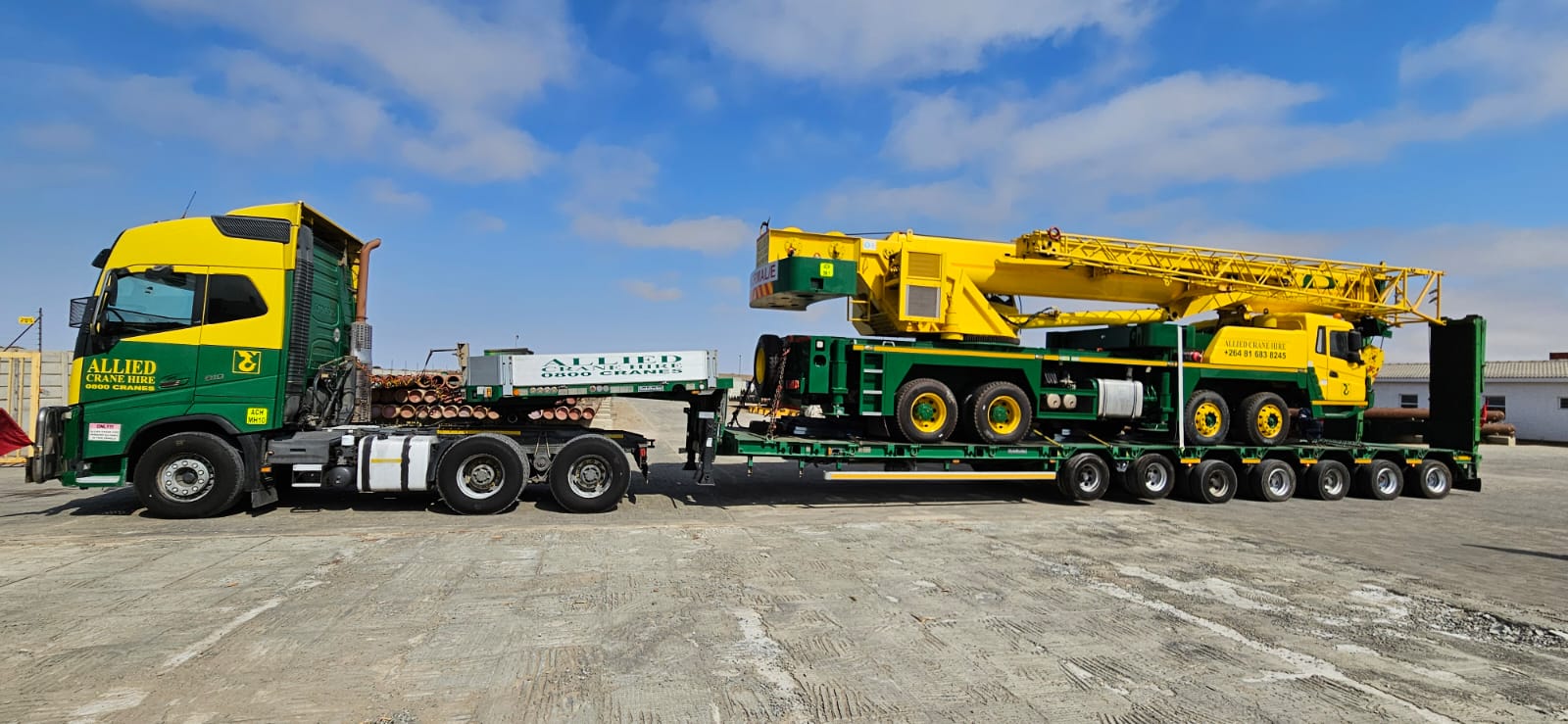 New Allied mobile crane arriving on a low-bed trailer