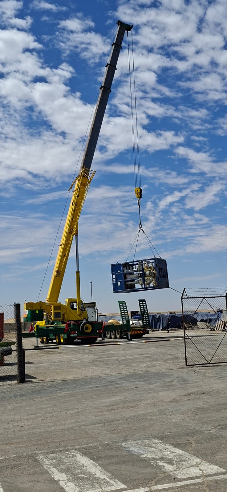 Allied operator lifting an equipment skid with a mobile crane